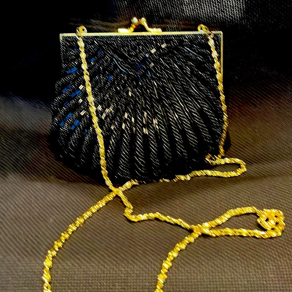 Beaded black Evening bag with gold Shane. Clam shell shape